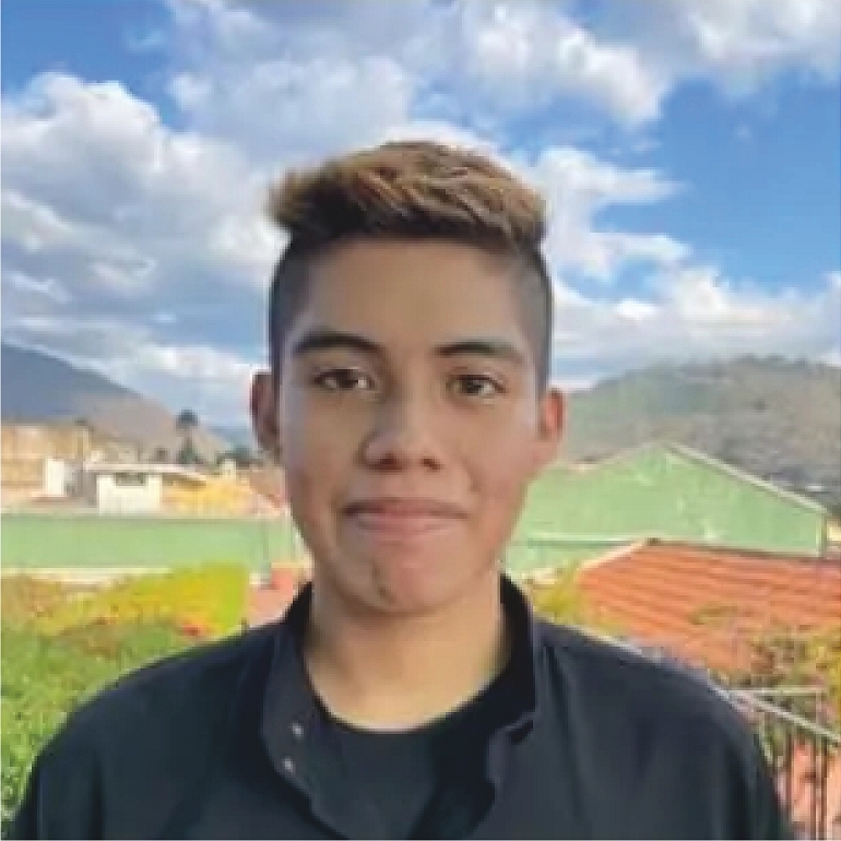 Cloudy sky over grassy hill